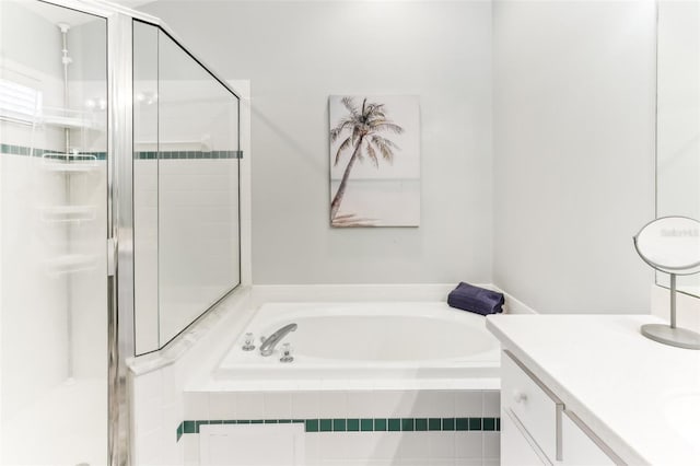 bathroom featuring separate shower and tub and vanity