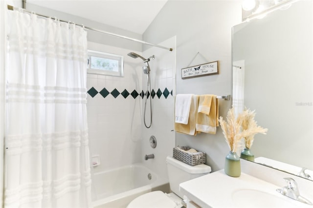 full bathroom with shower / bath combo with shower curtain, vanity, vaulted ceiling, and toilet