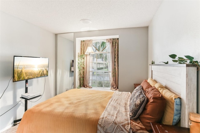 bedroom featuring a textured ceiling