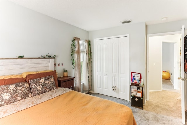 bedroom with a closet and carpet floors