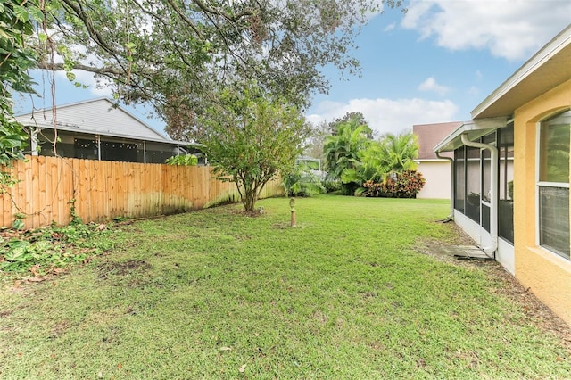 view of yard featuring a sunroom