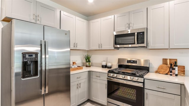 kitchen featuring appliances with stainless steel finishes and gray cabinetry