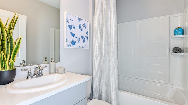 full bathroom with vanity, toilet, and shower / bath combo with shower curtain