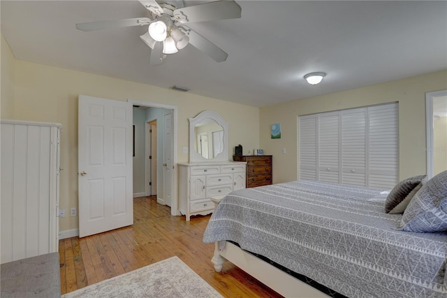 bedroom featuring light hardwood / wood-style flooring and ceiling fan