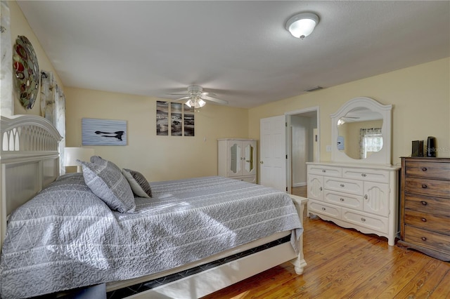 bedroom with ceiling fan and light hardwood / wood-style flooring