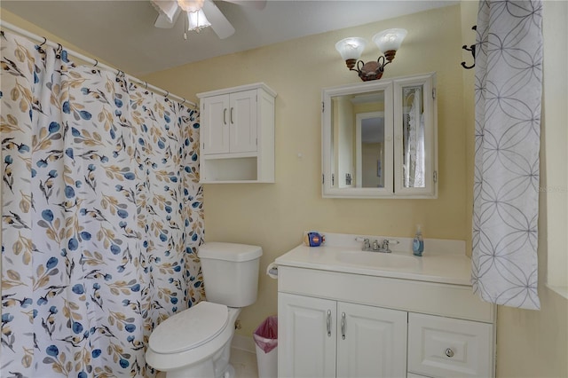 bathroom with walk in shower, vanity, toilet, and ceiling fan