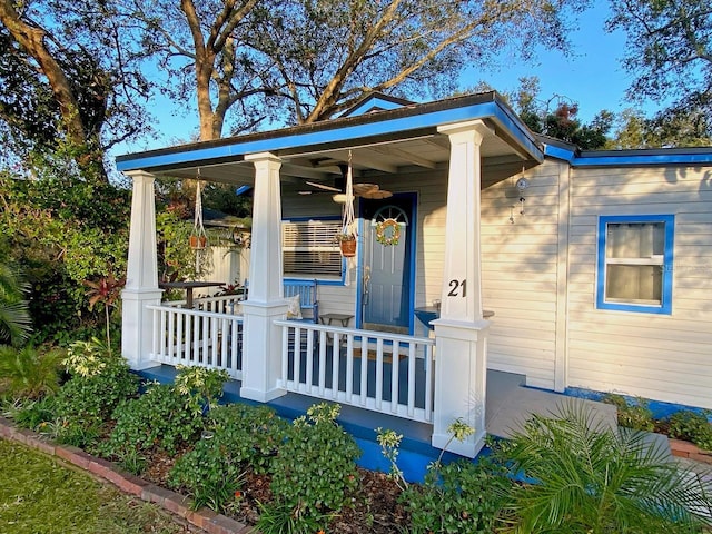 view of exterior entry with covered porch