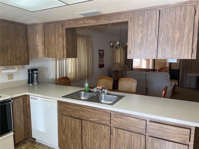 kitchen featuring kitchen peninsula, sink, electric range, a notable chandelier, and dishwasher