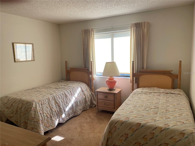 carpeted bedroom with a textured ceiling