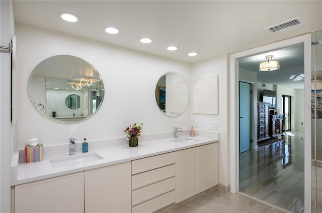 bathroom with vanity and hardwood / wood-style flooring