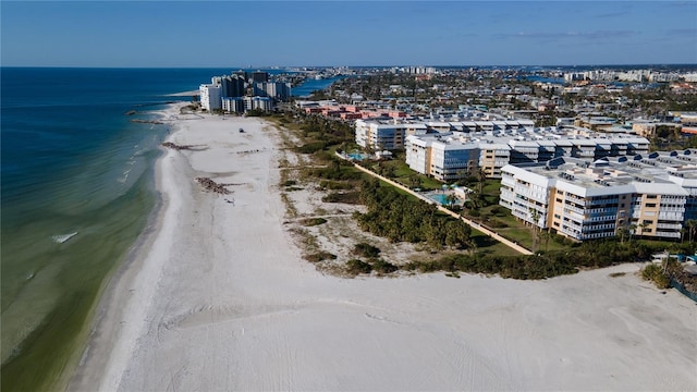 drone / aerial view with a water view and a beach view