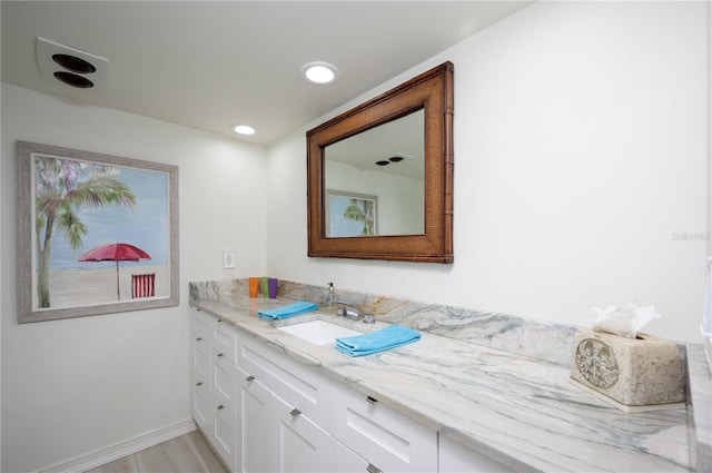 bathroom featuring vanity and wood-type flooring