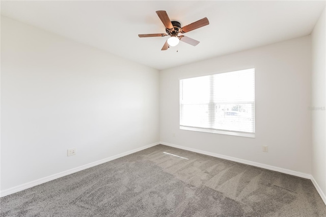 spare room with carpet flooring and ceiling fan