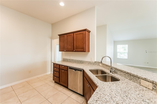 kitchen with dishwasher, light tile patterned flooring, light stone countertops, and sink