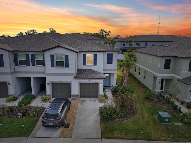 view of front of property with a lawn and a garage