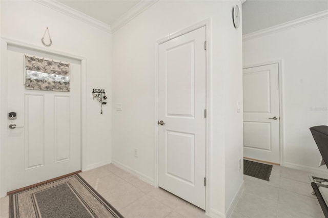 foyer with light tile patterned floors and crown molding