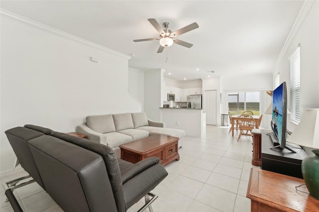 living room with ceiling fan, light tile patterned flooring, and crown molding