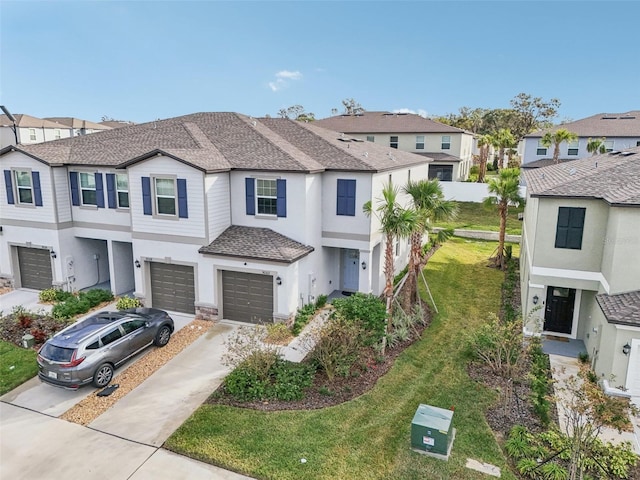 view of front of home with a garage and a front yard