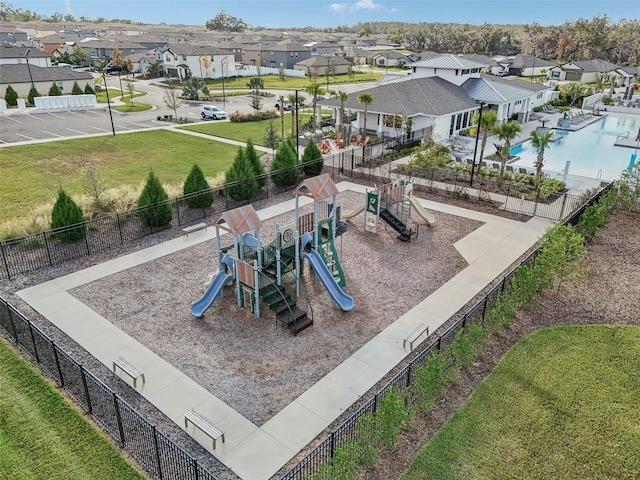 view of playground featuring a lawn