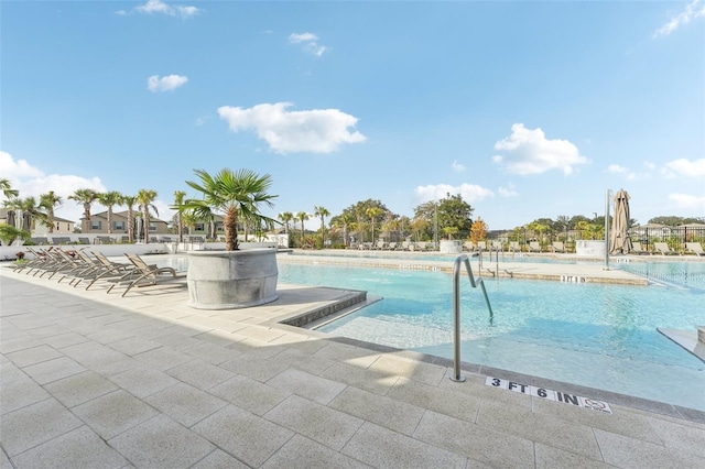 view of pool featuring a patio