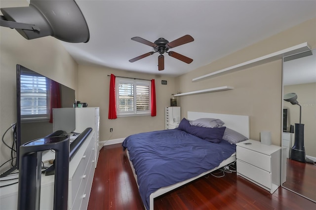 bedroom with dark wood-type flooring and ceiling fan