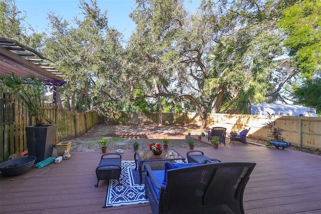 wooden deck with an outdoor living space and a pergola