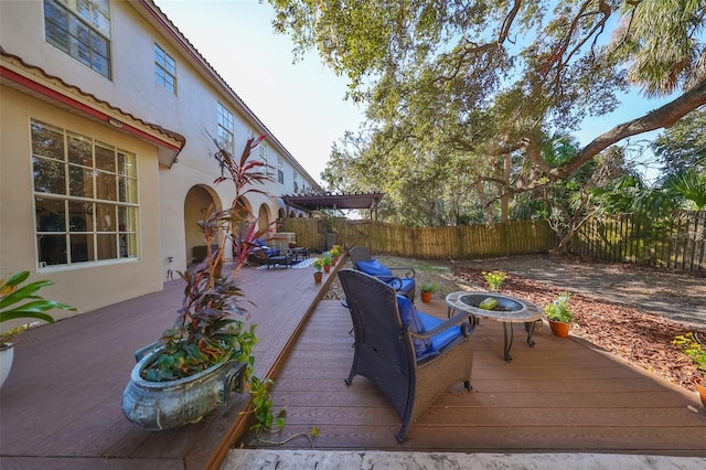 deck featuring an outdoor fire pit