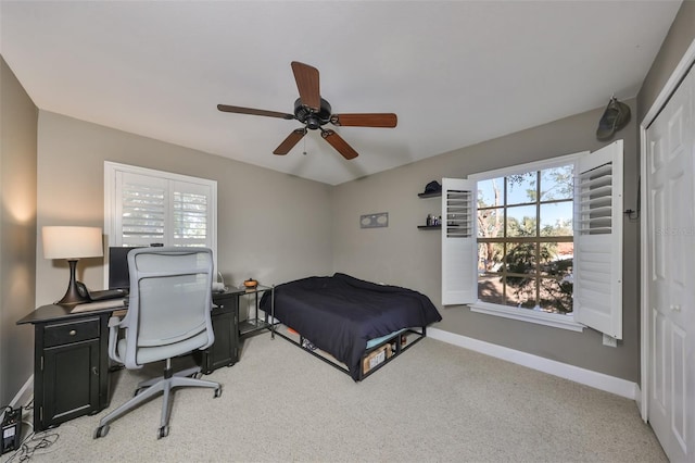 carpeted bedroom featuring ceiling fan