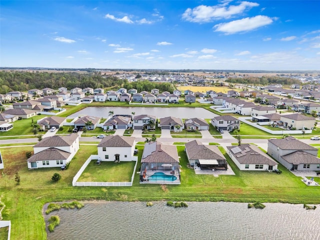 bird's eye view with a water view