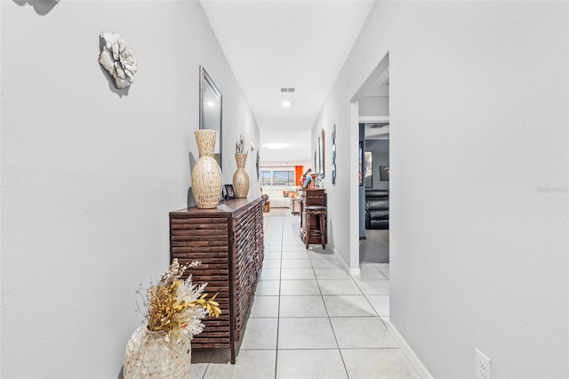 hallway with light tile patterned floors