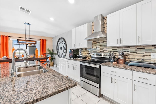 kitchen with white cabinetry, sink, wall chimney exhaust hood, and stainless steel electric range