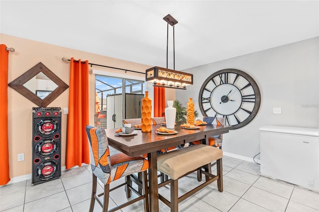 dining area featuring light tile patterned flooring