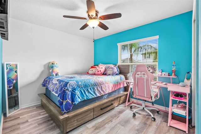 bedroom featuring ceiling fan and wood-type flooring