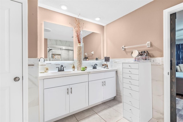 bathroom with tile patterned floors and vanity