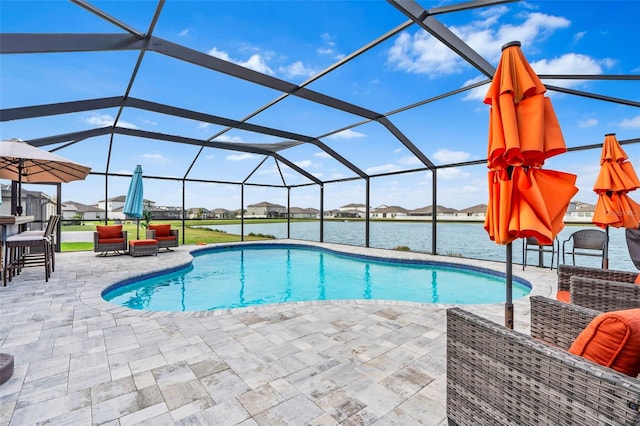 view of swimming pool featuring a lanai, a water view, and a patio