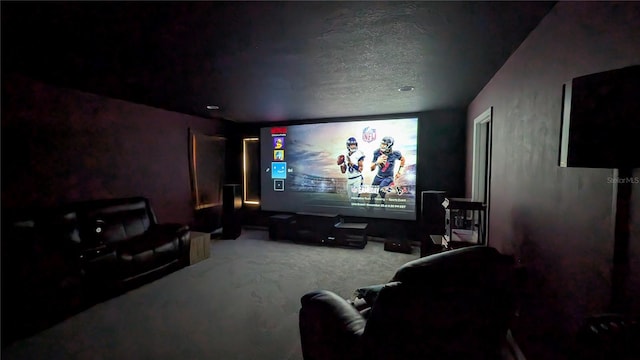 carpeted cinema room with a textured ceiling