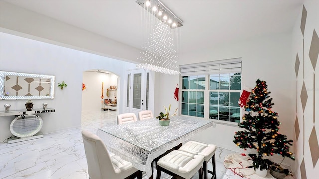 dining area featuring an inviting chandelier