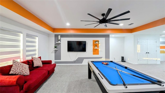 playroom with light carpet, ceiling fan, pool table, and a raised ceiling