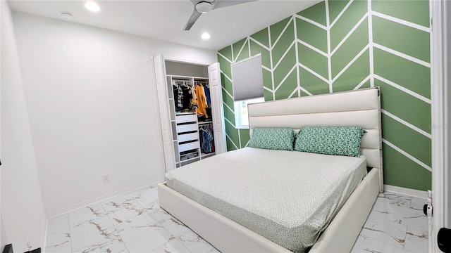 bedroom featuring ceiling fan and a closet