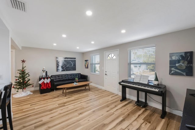 living room with light hardwood / wood-style floors