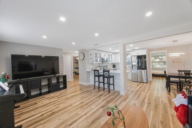 living room with light hardwood / wood-style floors