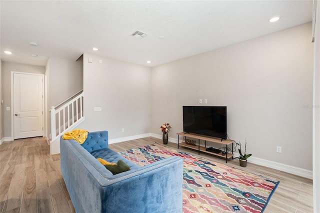 living room with light hardwood / wood-style floors