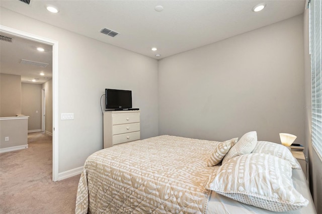 bedroom featuring light carpet