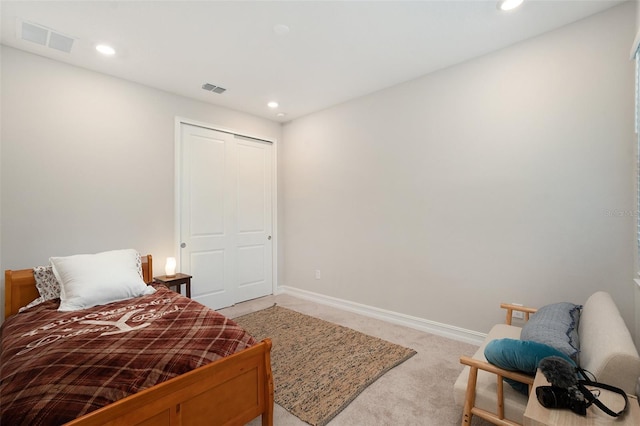 carpeted bedroom with a closet