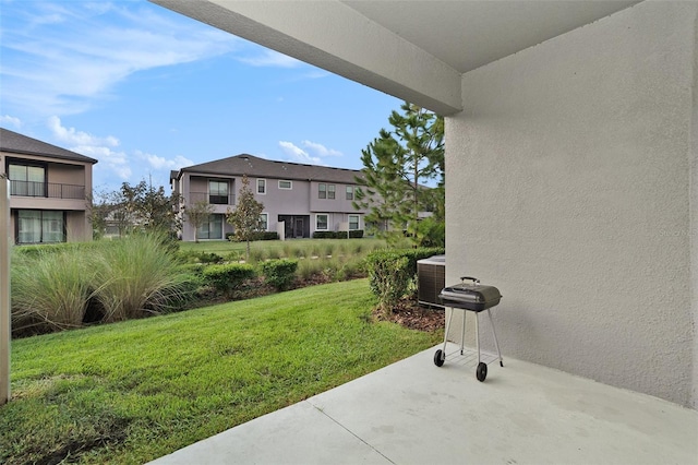 view of yard featuring cooling unit and a patio