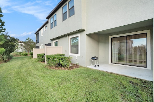 exterior space with a lawn and a patio