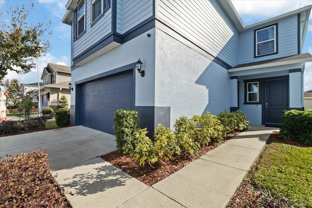 view of property exterior featuring a garage