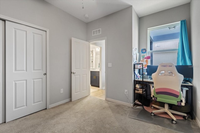 office area with light colored carpet