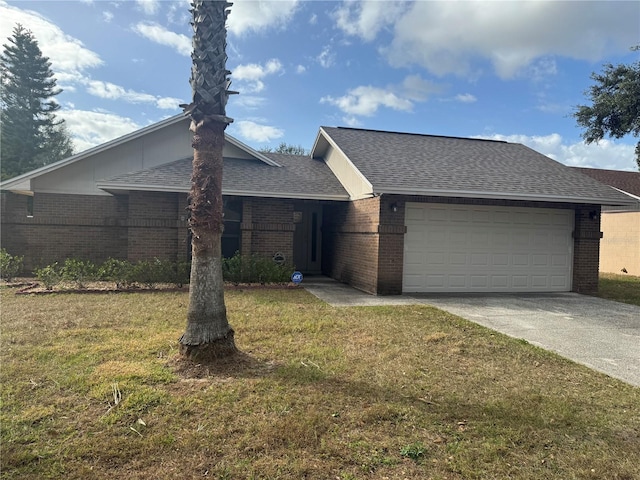 ranch-style home with a front lawn and a garage