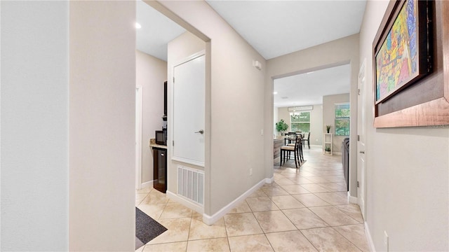 corridor featuring light tile patterned flooring